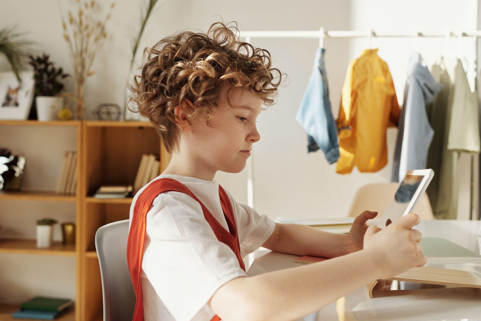 A child deeply focused on their own individual schoolwork